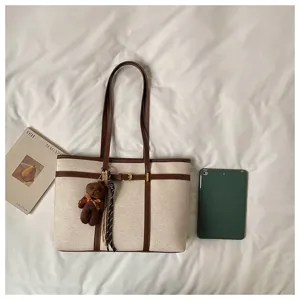 Large capacity canvas tote bag with contrast leather trim, vintage commuter shoulder bag.