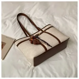 Large capacity canvas tote bag with brown leather contrast trim, vintage shoulder bag for women style.
