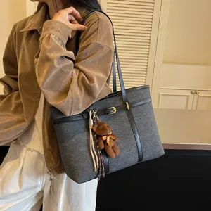 Large capacity tote bag, retro commuter shoulder handbag for women with cute bear pendant.