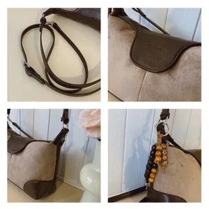 Vintage brown suede underarm shoulder bag details view, adjustable strap and wooden beads.