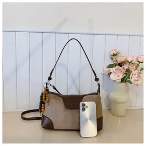 Retro patchwork shoulder bag for women, trendy chic casual commuter handbag with bead charm.