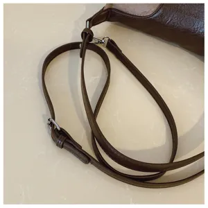 Retro brown leather shoulder underarm bag for women with adjustable strap and casual tote style.