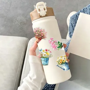 Watercolor floral stickers on insulated water bottle, cute DIY decor cup for daily use.