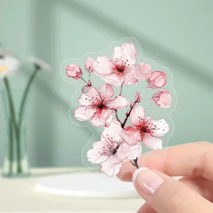 Transparent PET pink cherry blossom sticker detail, cute floral DIY planner craft decal close up.