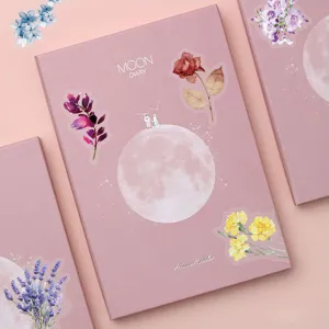 Pink aesthetic diary notebook gift box with moon and floral illustrations for creative writing.