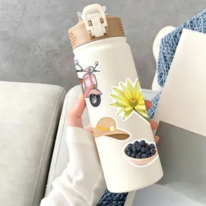 Close-up of decorative picnic lifestyle stickers on a thermal bottle, charming design details.