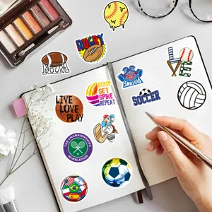Detailed view of sports theme waterproof graffiti stickers pasted on a notebook desk flatlay.