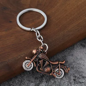 Retro metal motorcycle keychain pendant detail view, stylish hip-hop men accessory keyring.