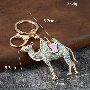 Detail view of the creative rhinestone camel keychain with blue crystals and enamel saddle.