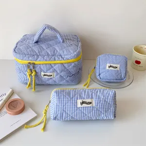 Quilted blue gingham cosmetic bag set with yellow zippers, large makeup storage organizer.