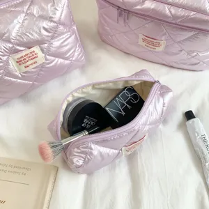 Quilted metallic cosmetic bag for women, shiny travel makeup pouch and daily storage organizer.