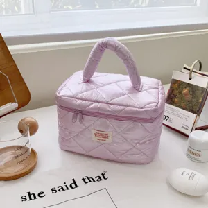 Light purple puff quilted cosmetic bag, portable travel toiletry pouch for daily skincare items.