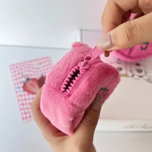 Close-up of the cute pink plush coin purse zipper detail, showing soft fluffy texture.