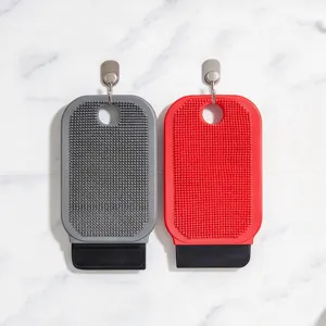 Silicone fruit and vegetable cleaning brush detail view, dual-use scrubber with scraper.