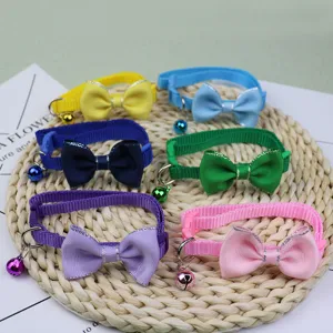 Colorful pet collar with cute bow and bell, durable nylon puppy cat neck strap for daily wear.