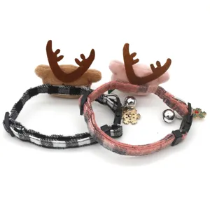 Christmas pet collar with cute reindeer antlers, plaid pattern, bell and snowflake charms.