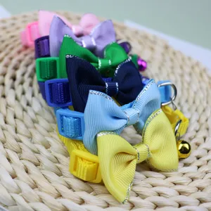 Colorful pet collar with cute bow and bell, adjustable nylon strap for small cats and dogs daily wear.