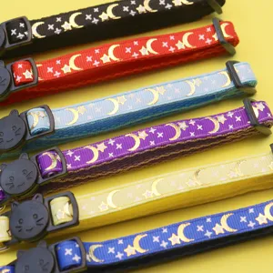Detailed close-up of colorful pet collars featuring foil moon print and cute cat face buckles.