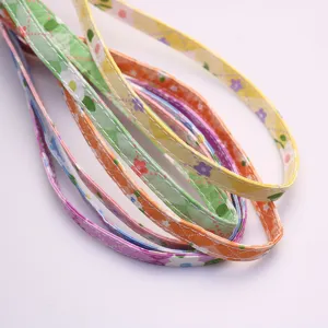Colorful floral pet collar webbing detail shot, high quality fabric dog leash strap accessory.