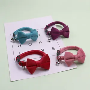 Velvet pet collar detail, soft material with cute bow and crisp bell, suitable for cats and dogs.