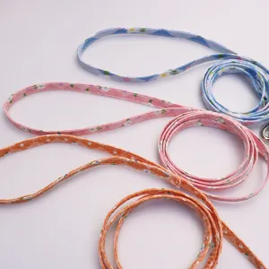 Floral pet leash set detail view showing colorful straps and metal clips for small dogs cats