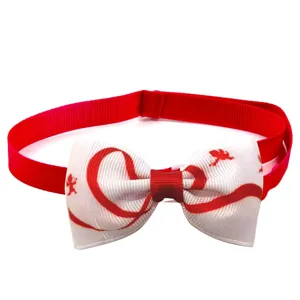 Detailed close-up of the red and white Valentine's pet bow tie showing ribbon texture.
