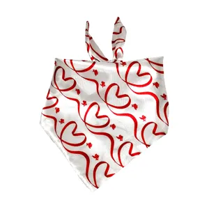 Close-up of a white satin pet bandana featuring red heart ribbons and cute cupids for pets.