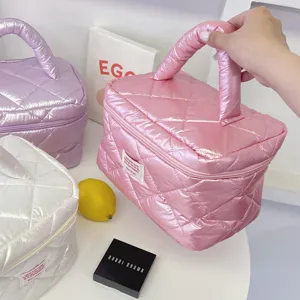 Glossy quilted puffer cosmetic bag, stylish pearl shine travel makeup organizer handbag.