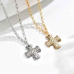 French vintage hammered cross necklace, stylish minimalist metal texture pendant.