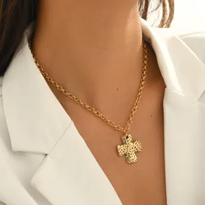 French vintage gold hammered cross pendant necklace for women fashion jewelry detail shot