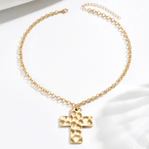 French retro hammered cross necklace for women, stylish gold metal pendant jewelry piece.