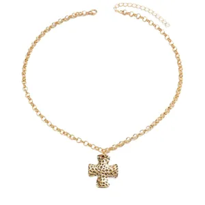French vintage gold hammered cross necklace minimalist metal texture fashion jewelry main view