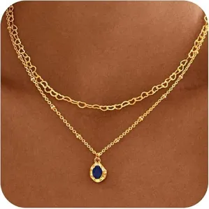Collier double couche plaque or 14k raffine avec maillons coeur et pierre bleue.