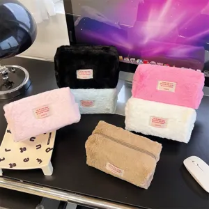 Fluffy plush cosmetic pouch detail view, soft storage bag for daily makeup and toiletries.