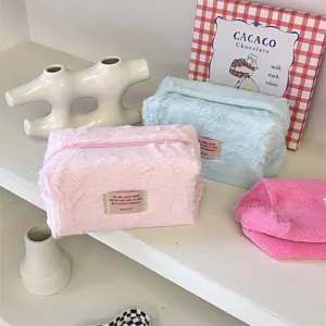 Korean style plush cosmetic bag large capacity soft fuzzy travel makeup pouch for daily storage.