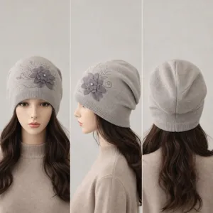 Knitted beanie hat for women featuring 3D flower and rhinestone details, slouchy winter cap.