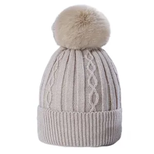 Women winter thick cable knit beanie hat with big faux fur pom warm pull-on skull cap.