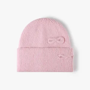 Pink knit beanie for women, cute double bow design, soft wool blend warm winter hat detail