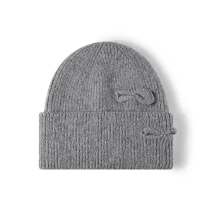 Grey knit beanie detail, featuring soft rabbit hair blend and cute dual bow decoration.