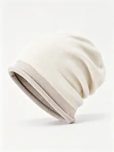 Close-up of thick winter knit beanie hat, contrast color soft slouchy wool skull cap detail.
