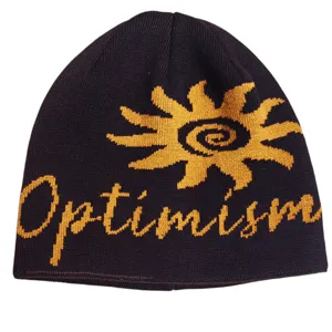 Close-up detail of the vintage knitted beanie showing the yellow sun pattern and optimism text.