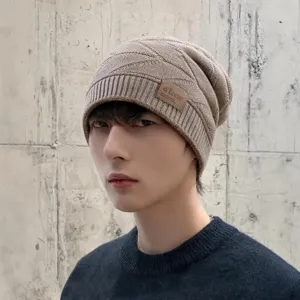 Winter warm knitted beanie hat for men and women, stylish slouchy cap for cold weather.