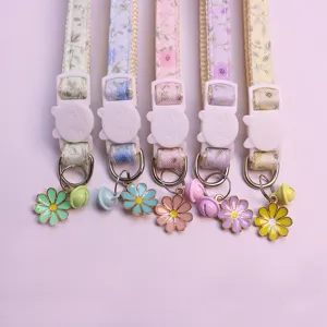 Floral pet collar with cute bell and flower pendant, soft fabric for cats and small dogs.