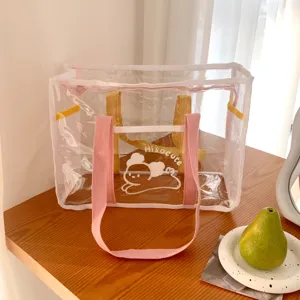 Clear PVC beach tote bag with pink straps and cute bear graphic for summer outdoor travel.