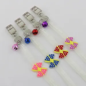 Transparent luminous pet collar with cute bow and bell for cats and dogs safety walking.