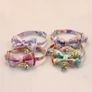 Cute Japanese floral cat collar with bow and bell, adjustable pet neck strap detail.