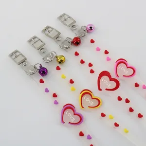 Transparent pet collar with metal buckle, cute heart charms and bell, adjustable safe strap for cats.