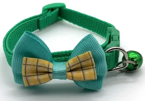 Cute plaid pet collar detail featuring double bow tie, green bell and secure plastic buckle.
