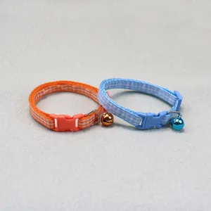 Pet plaid fabric dog cat collar with bell detail view, colorful adjustable pet neck strap.
