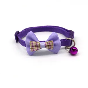 Close-up details of the purple pet collar, featuring a cute double plaid bow and metal bell.